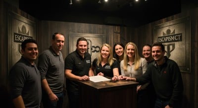 Players concentrating on clues in a themed mystery room