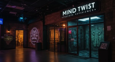 An empty hall with a bill board saying Mind Twist Escape Rooms.