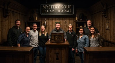 A team celebrating their escape room challenge